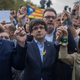 President Carles Puigdemont, center, with Vice President Oriol Junqueras, left. Via the AP.